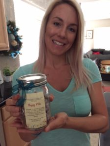 Amanda Jaramillo shows off a bottle of placenta capsules.  She is the owner of Heaven Sent Placenta Encapsulation Services in Arizona.   